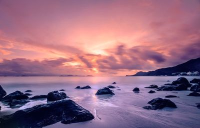 Scenic view of sea against cloudy sky