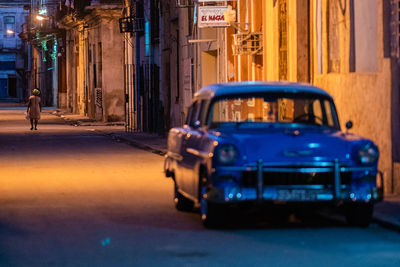 View of traffic on city street at night