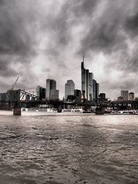 Cityscape against cloudy sky