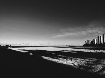 Scenic view of sea and buildings against sky