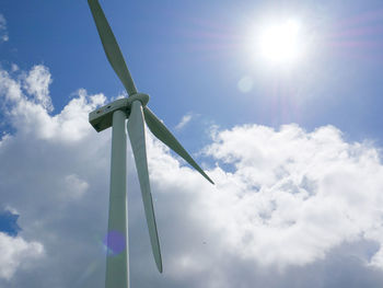 Low angle view of wind turbine against sky