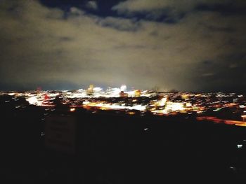 Illuminated buildings in city at night