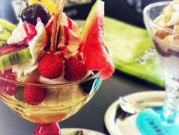 Close-up of strawberries in glass on table