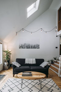 Scandinavian living room interior with couch coffee table and carpet