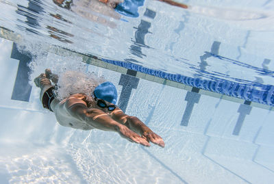 Man swimming in pool