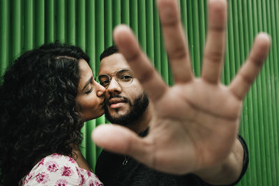 Portrait of couple kissing outdoors