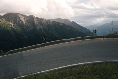 Serpentine mountain road with mountain range