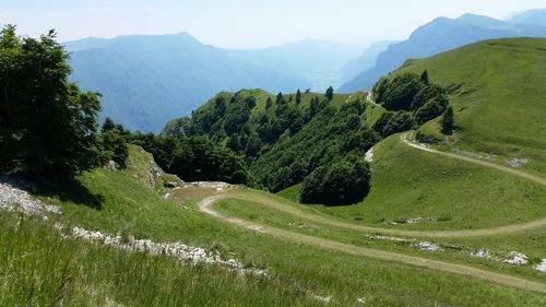 High angle view of green landscape against sky