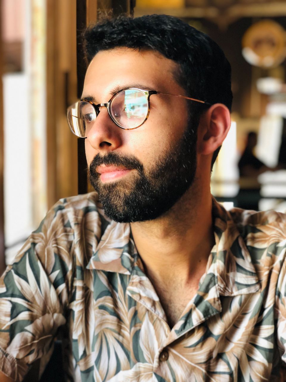 one person, beard, facial hair, headshot, portrait, young men, real people, young adult, men, glasses, indoors, front view, leisure activity, lifestyles, males, adult, eyeglasses, close-up, contemplation