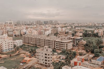 High angle view of buildings in city against sky