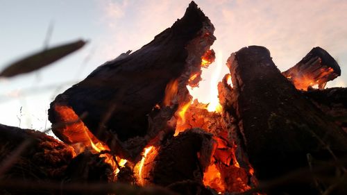 Close-up of bonfire against sky