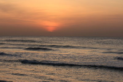 View of calm sea at sunset