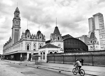 Buildings against cloudy sky