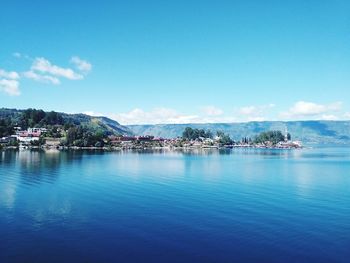 Scenic view of sea against blue sky