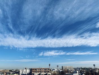 Low angle view of buildings against blue sky