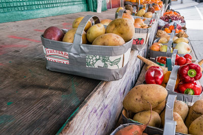 Various fruits in crate at market stall