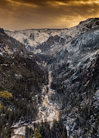 Scenic view of snowcapped mountains against sky during sunset