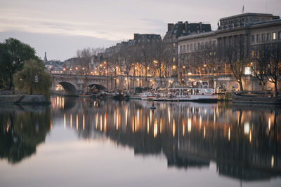 Bridge over river with buildings in background