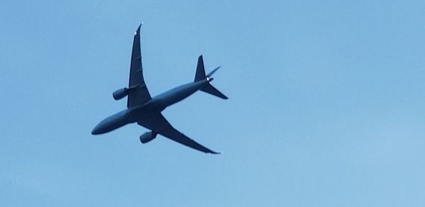 Low angle view of airplane against clear sky