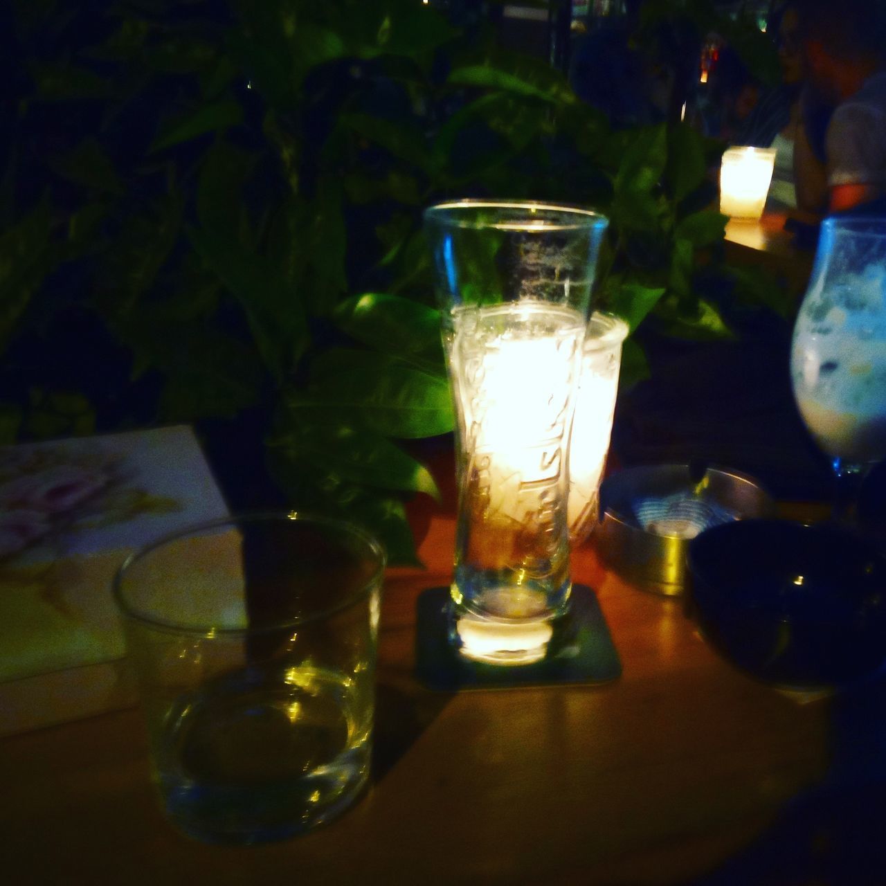 CLOSE-UP OF WINE GLASSES ON TABLE