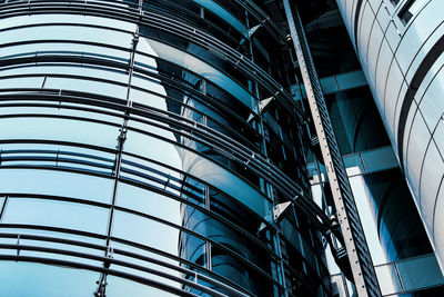 Low angle view of modern glass building in city