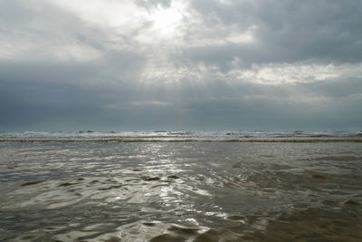 Scenic view of sea and cloudy sky