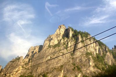 Low angle view of rock formations against sky