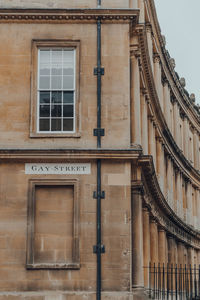 Street name sign on a wall of stone building on gay street in bath, somerset, uk.