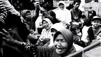 GROUP OF PEOPLE IN THE BACKGROUND