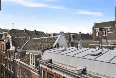 High angle view of buildings in town against sky