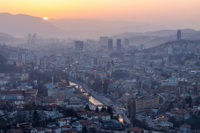 High angle view of city at sunset