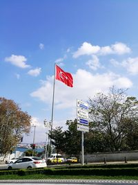 Low angle view of flag against sky