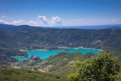 Scenic view of mountains against blue sky