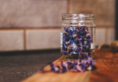 Close-up of glass jar on table