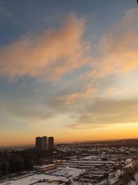 High angle view of buildings against sky during sunset