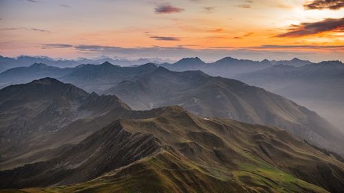 Scenic view of mountains against sky during sunset