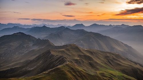 Scenic view of mountains against sky during sunset