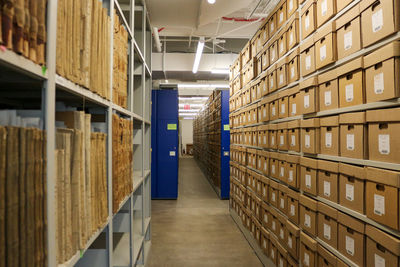 Corridor of building showing rows of boxes.