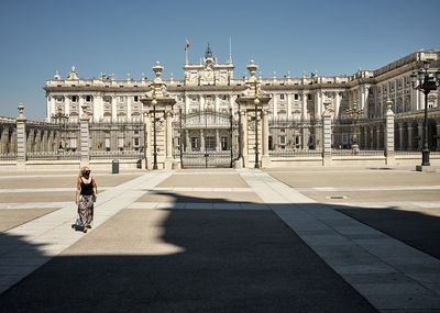 Traveling woman near place in summer