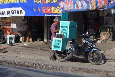 Person standing on road in city
