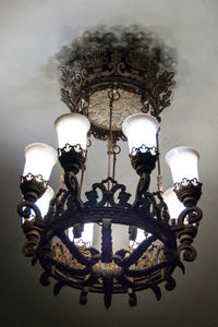 Low angle view of illuminated chandelier