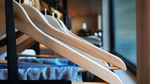 Close-up of wooden coathangers at home