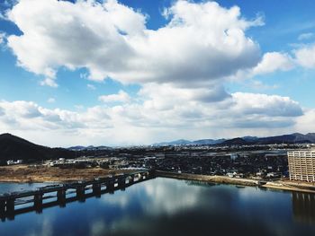 Scenic view of lake against sky during winter