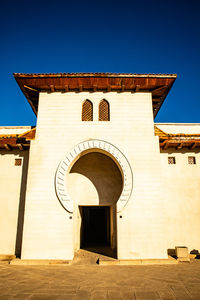 Low angle view of historic building against clear sky