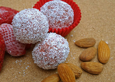 High angle view of energy bites with healthy fats and no sugar on wooden table