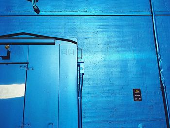 Closed door of blue wall