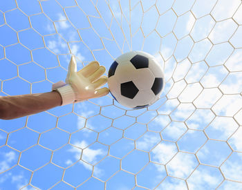 Low angle view of soccer ball on field