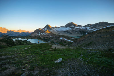 Scenic view of snowcapped mountains against clear sky