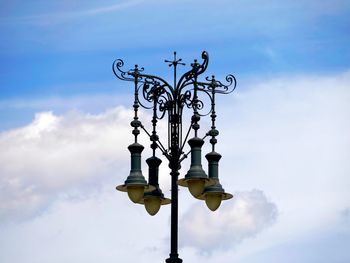 Low angle view of street light against sky