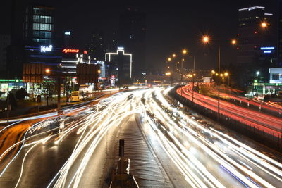 High angle view of light trails on road at night